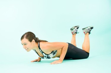 Woman performing modified push-ups.