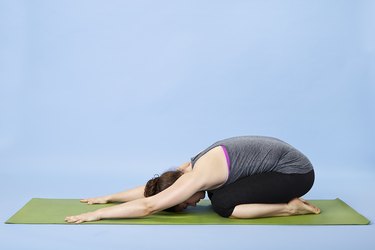 Woman performing Child's pose for back pain