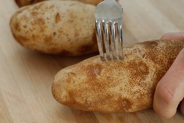 poking holes in potato with fork