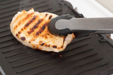 Cooking chicken breast on a grill pan
