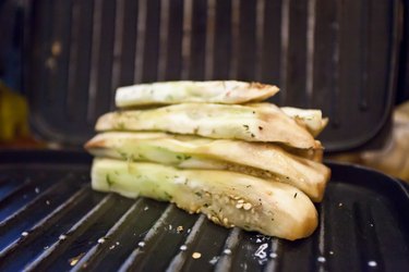 white eggplant slices on the grill