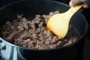 stirring beef in pot