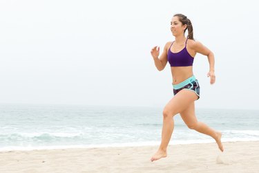 Woman Running/Sprinting During Her Beach Workout
