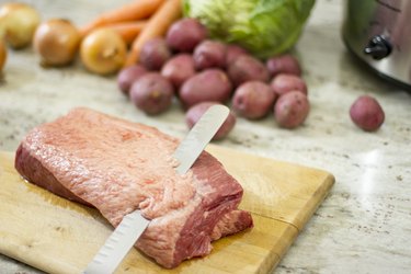 removing fat from corned beef with knife