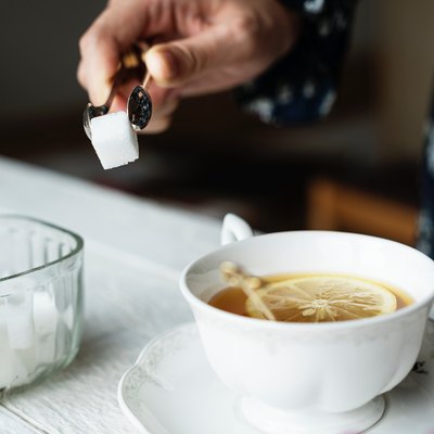 Sugar cube tea cup on table
