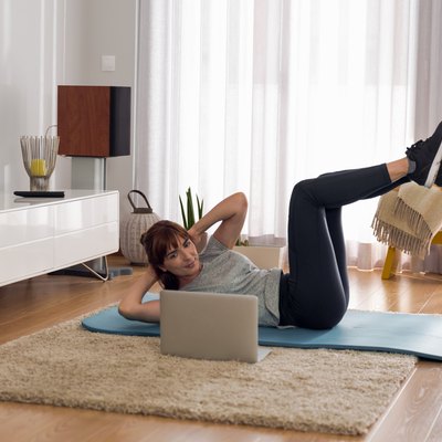 Woman doing video workout at home