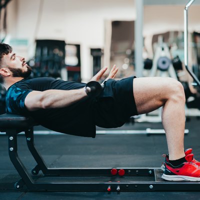 Man doing hip thrust exercise for glute strength