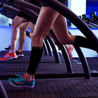 Runners doing treadmill workout class at Mile High Run Club