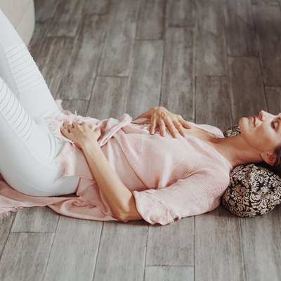 woman practicing yoga nidra to help improve sleep quality
