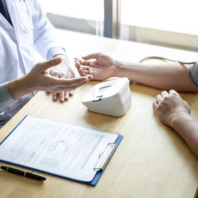 patient getting their blood pressure taken