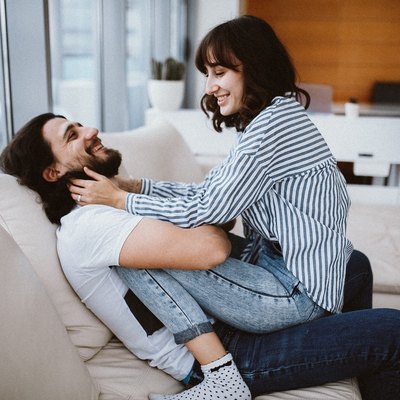 couple cuddling on the couch