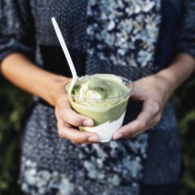 Woman holding avocado ice cream