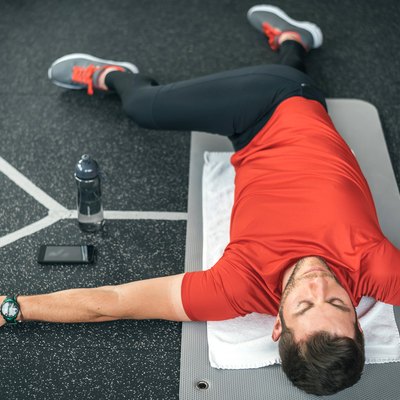 Man doing back stretches to help with his back pain
