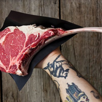 man holding steak