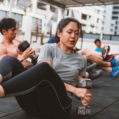 Woman exercising on floor to lose inches of waist fast