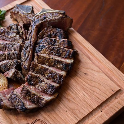 sliced steak on cutting board
