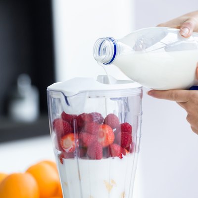Dairy free lactose free milk pouring into blender for smoothie