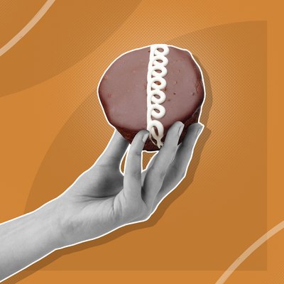 Custom graphic showing hand holding cupcake