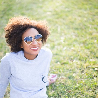 woman wearing sunglasses to protect against skin cancer