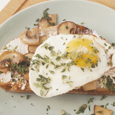 mushroom-ricotta toast with a fried egg