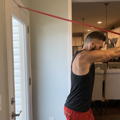 Man using a resistance band to strengthen his triceps