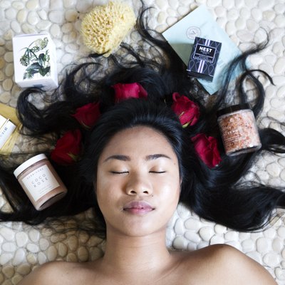 girl surrounded by bath products