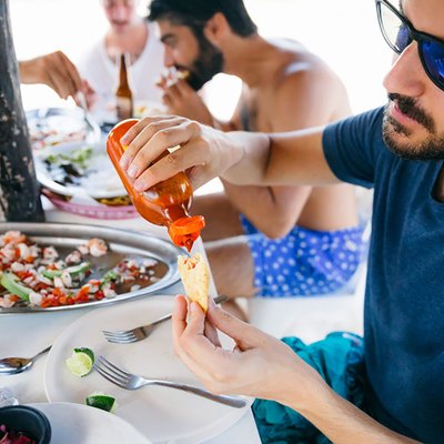 sexy men eating ceviche