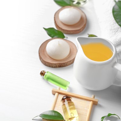 Spa composition with tea tree oil on white background