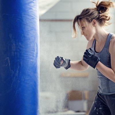 Female boxer in an abandoned warehouse