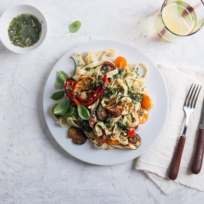 Fettucine with roasted colorful vegetables and parsley pesto