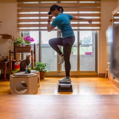 Woman Doing a Step Aerobics Workout at Home
