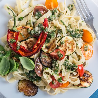 Fettucine with roasted colorful vegetables and parsley pesto