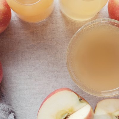 Apple cider vinegar with mother in glass bowl, probiotics food for gut health