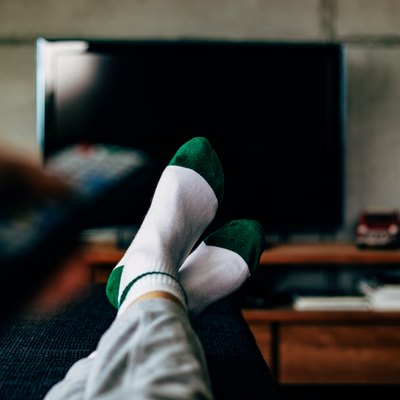 Personal perspective of a woman watching television in a living room