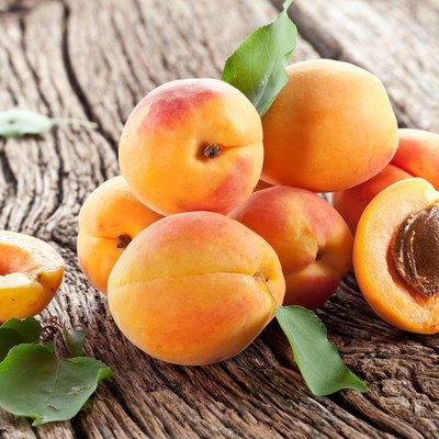 Apricots with leaves.