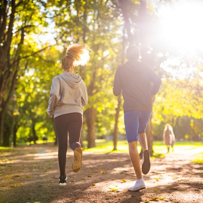 Couple exercising in park.