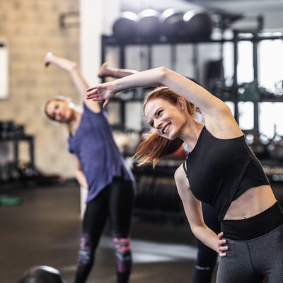 Group of People Exercising at a Gym