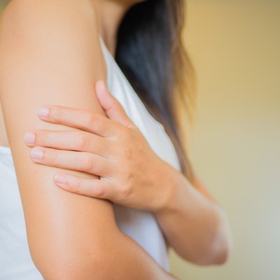 Closeup female's arm. Arm pain and injury. Health care and medical concept.