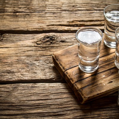 Glasses with vodka on the old Board.