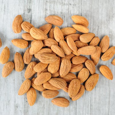 High Angle View Of Almonds On Wood
