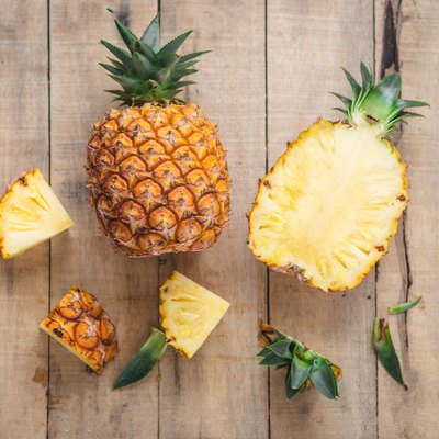 Directly Above Shot Of Pineapples On Cutting Board