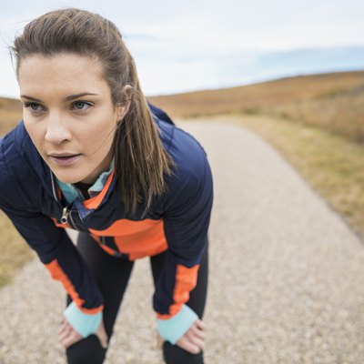 Runner resting on rural path