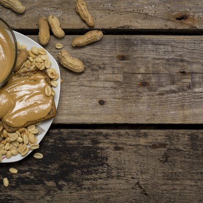 Peanut butter sandwiches on wooden table. Top view. Copy space.