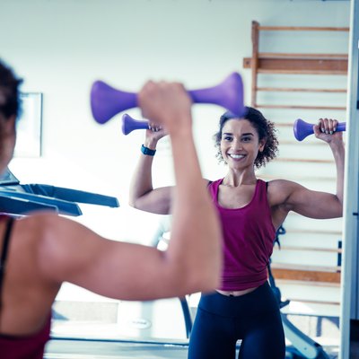 Woman Weight Training With Dumbbells