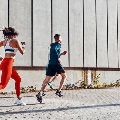 Full length of young people in sports clothing