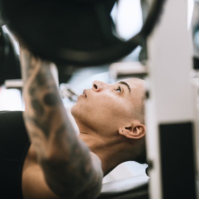 Strong and Fit Woman Working Out in Gym