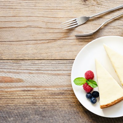 Two slices of cheesecake and fresh berries
