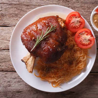 pork shank, sauerkraut and sauce. horizontal top view