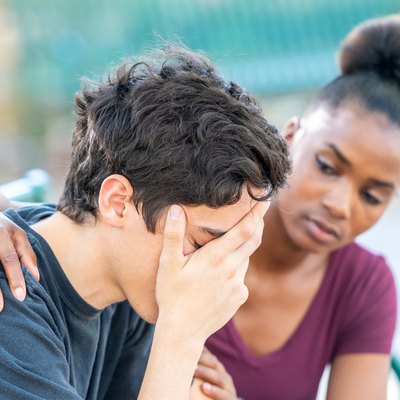 Diverse young couple, he is very stressed