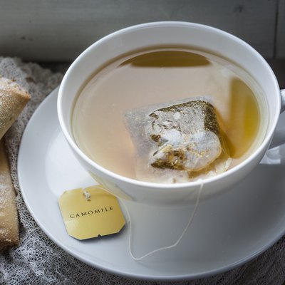 Chamomile tea and biscuits on window sill